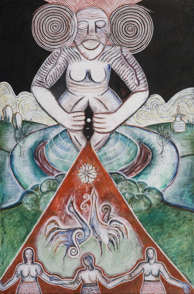 A painted large female figure with breasts and a vagina, which is held open by hands. A stream of red leaves the opening, within in are a star shaped flower, two birds and a trio of women holding hands.