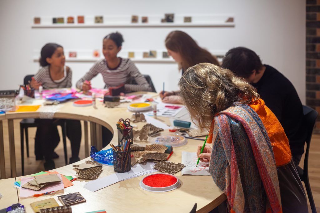 Visitors drawing in the Studio.