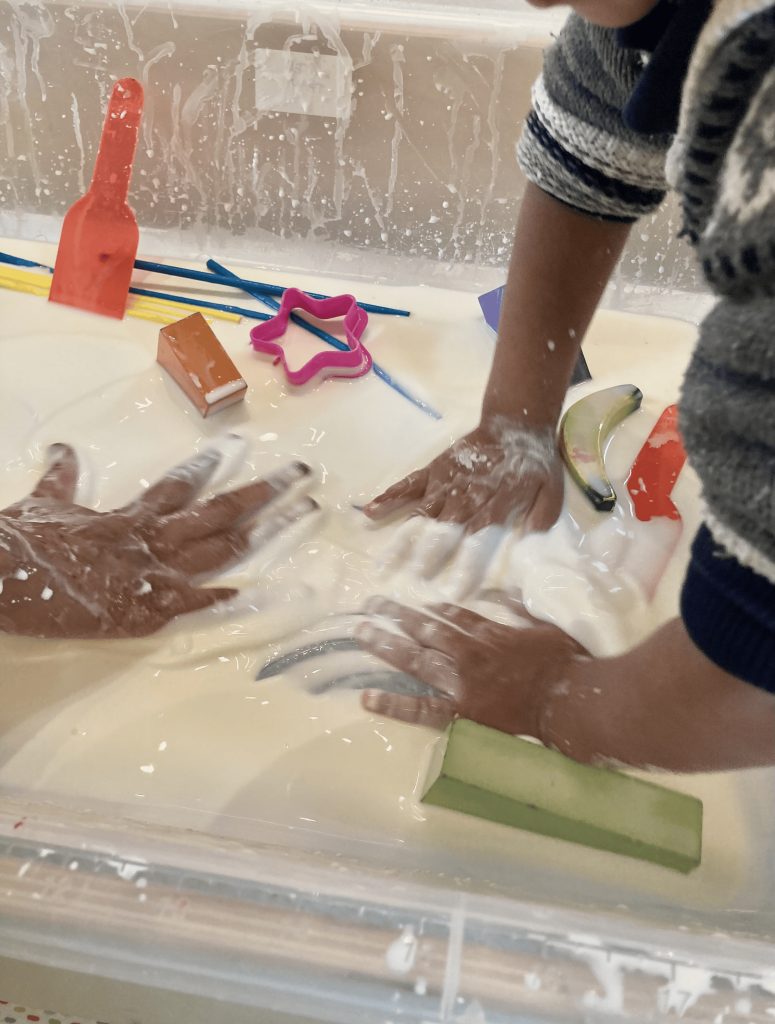 Children taking part in sensory play. 