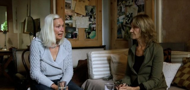 Anna Ridley and Barbara Steveni sit talking in Steveni's sitting room.